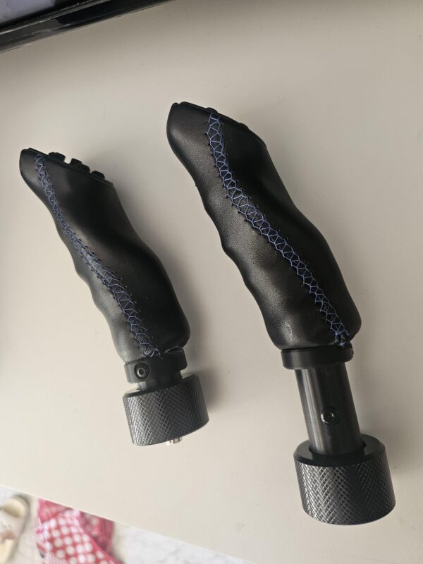 il_fullxfull.7489932809_d6ft.jpg Schuwirth glider stick grips with blue stitching detail