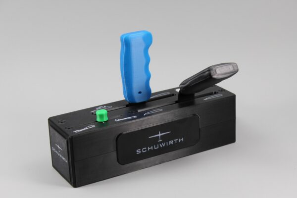 il_fullxfull.8067253783_8kst-1.jpg Schuwirth glider control joystick - black control panel with blue handle, black lever, and green button